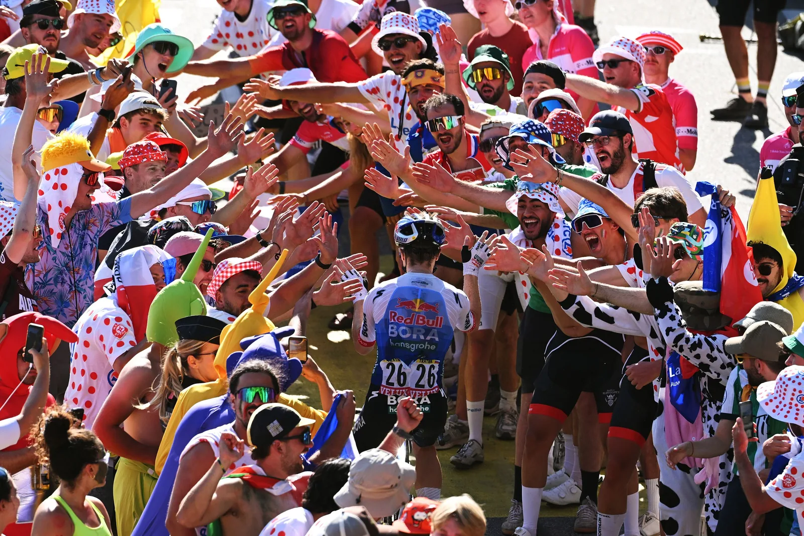 Pogacar conquers Alpe d’Huez in record climb to win stage 19 and extend Tour de France lead