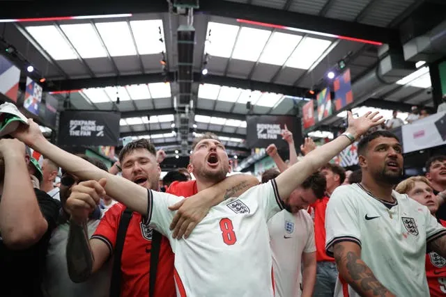 Fans watch a screening of the England match at Boxpark Wembley in London