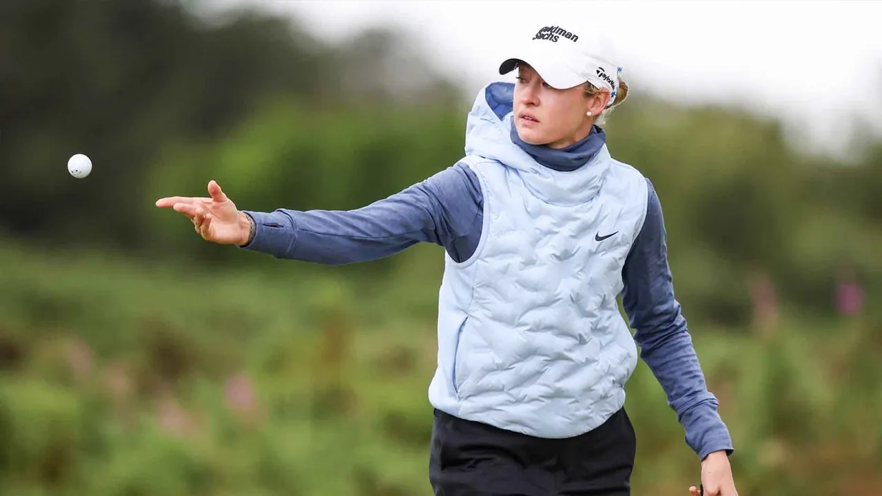 Nelly Korda tosses a golf ball during the ISPS HANDA Women's Scottish Open