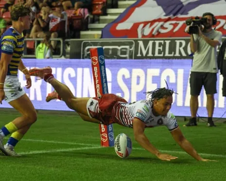 Austin Daniel dives over for a try