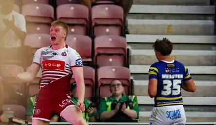 Zach Eckersley jumps for joy after scoring a try