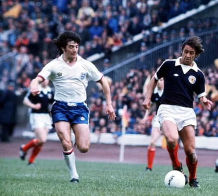 Kevin Keegan pursuing Don Masson during an England v Scotland match in 1976.