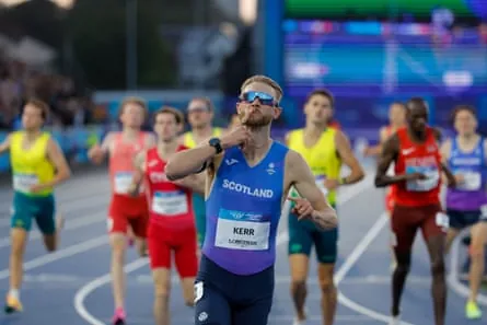 Josh Kerr celebrates as he crosses the finish line to win the men’s one mile final at the Commonwealth Games in Glasgow.